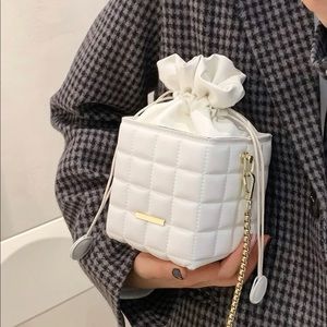 White drawstring bucket bag